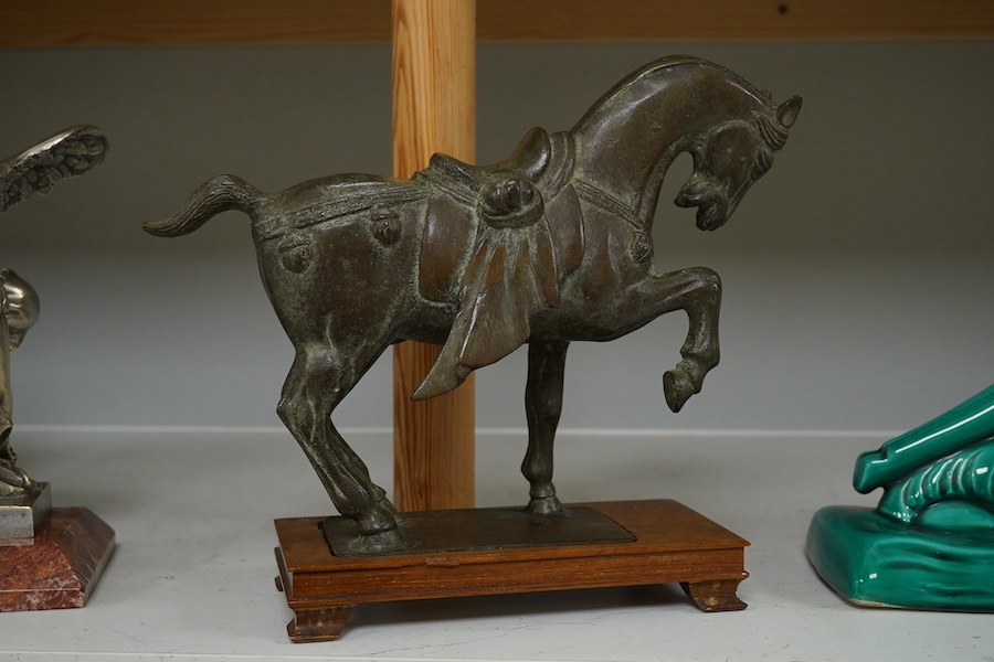 A Chinese bronze figure of a horse, Tang style, signed to the base, 24cm high. Condition - good